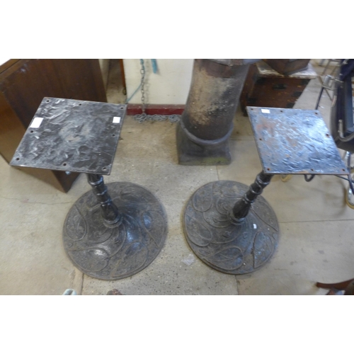 266 - A pair of cast iron pub table bases