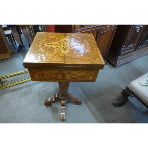 27 - An Italian style rosewood and marquetry inlaid fold over single drawer writing table