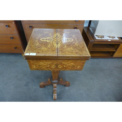 27 - An Italian style rosewood and marquetry inlaid fold over single drawer writing table