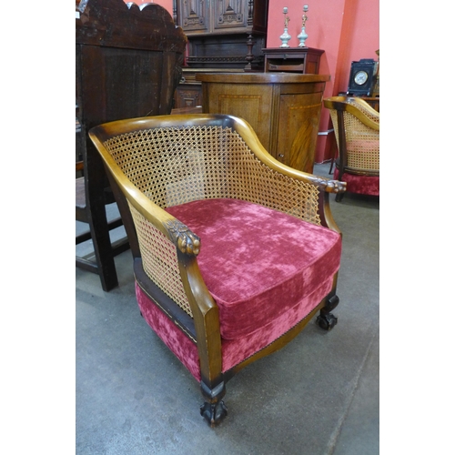 30 - A pair of 1930's carved walnut bergere armchairs