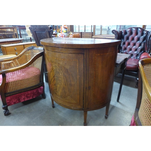 34 - An Edward VII inlaid mahogany bow front single door side cabinet