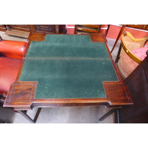 35 - A George III mahogany rectangular fold over card table