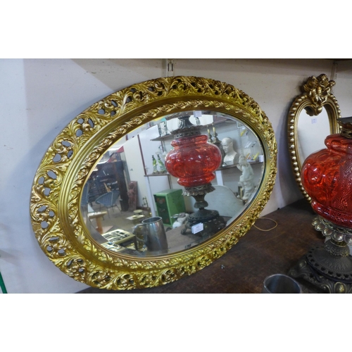 353 - A gilt framed oval mirror