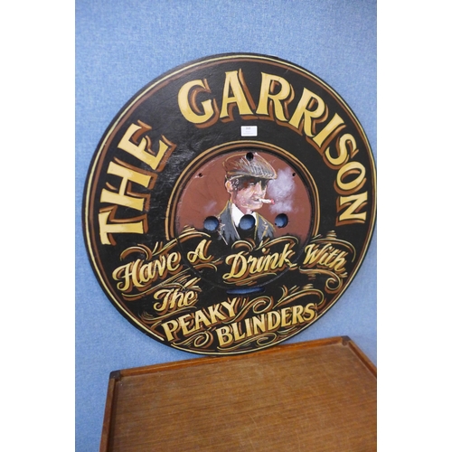 368 - A painted wooden pub sign, The Garrison