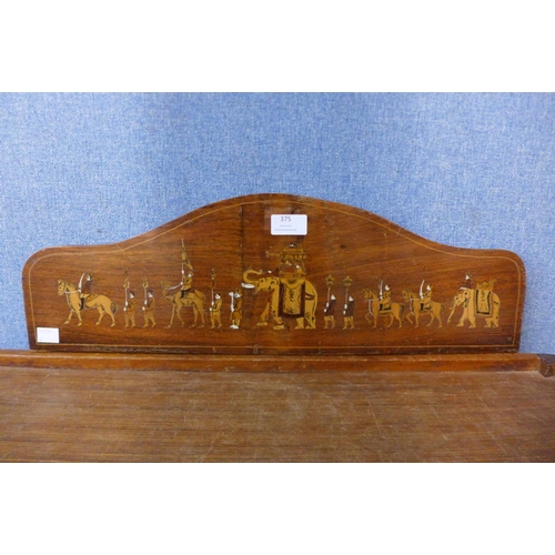 375 - An Indian inland mahogany plaque