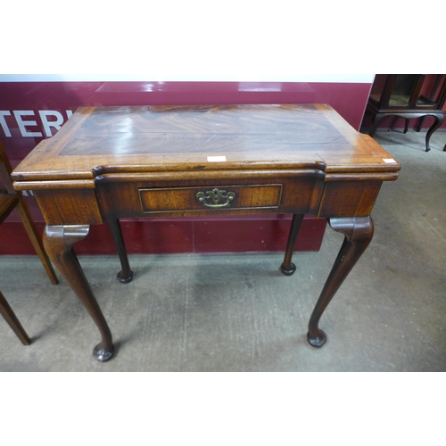 4 - A George II mahogany rectangular fold over tea table