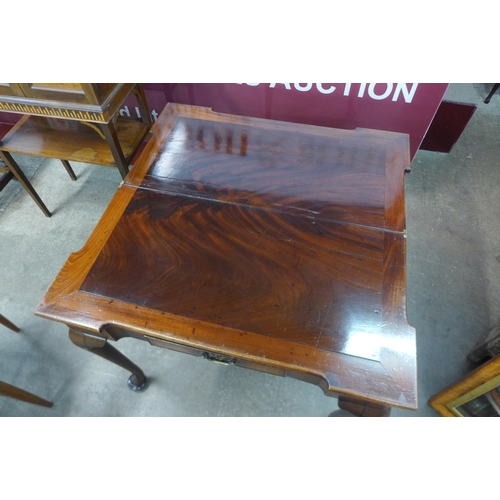 4 - A George II mahogany rectangular fold over tea table