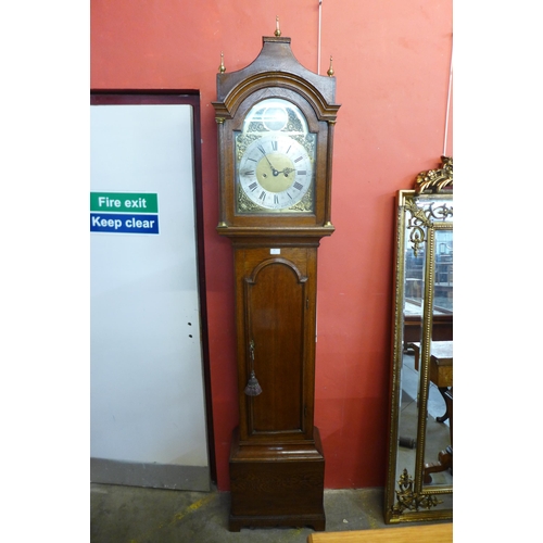 40 - A George III Lancashire oak 8 day longcase clock, the 12 inch arched brass dial signed Raynor, Bury