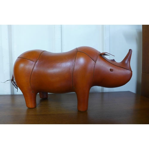 43 - A brown leather rhinoceros stool