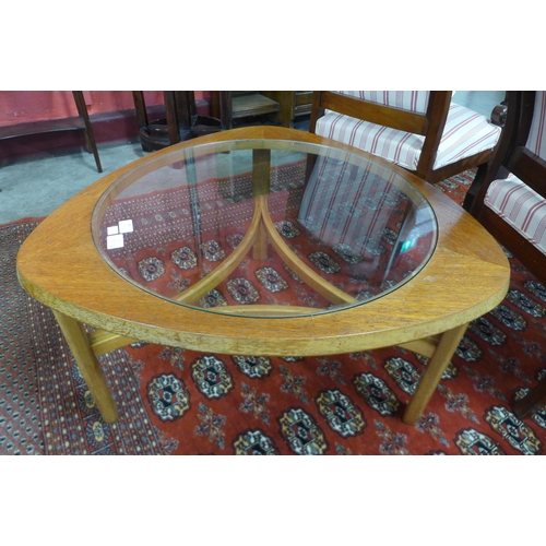 48 - A Nathan teak and glass topped triangular coffee table