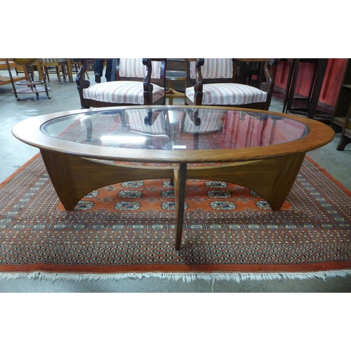 49 - A G-Plan Astro teak and glass topped oval coffee table