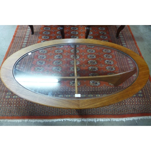 49 - A G-Plan Astro teak and glass topped oval coffee table