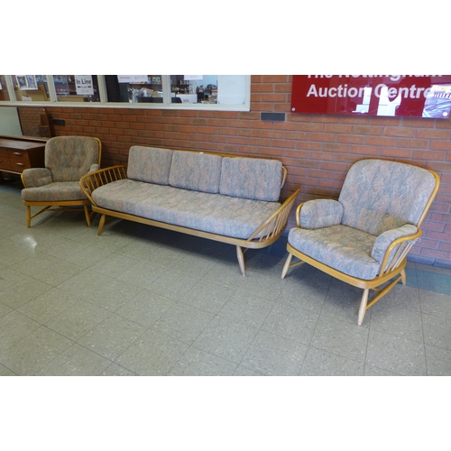 76 - An Ercol Blonde elm and beech 355 model studio couch and pair of matching armchairs