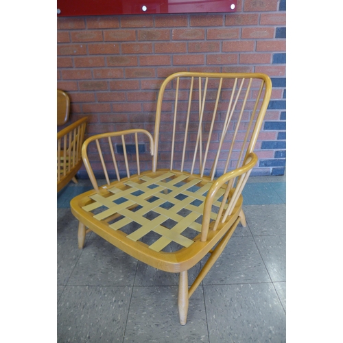 76 - An Ercol Blonde elm and beech 355 model studio couch and pair of matching armchairs