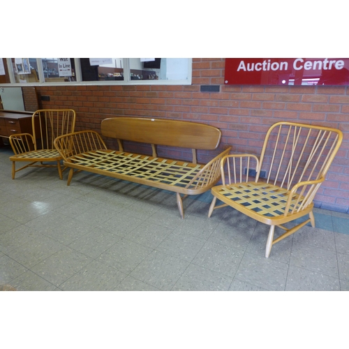 76 - An Ercol Blonde elm and beech 355 model studio couch and pair of matching armchairs