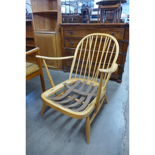 77 - A pair of Ercol Blonde beech Windsor armchairs