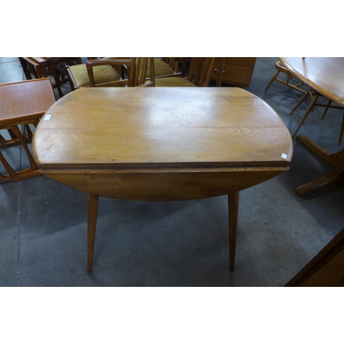 85 - An Ercol Blonde elm and beech drop-leaf table