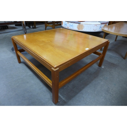 90 - A teak square coffee table