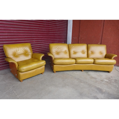 94 - A G-Plan teak and leather upholstered Tulip settee and matching armchair

* Please note this lot may... 