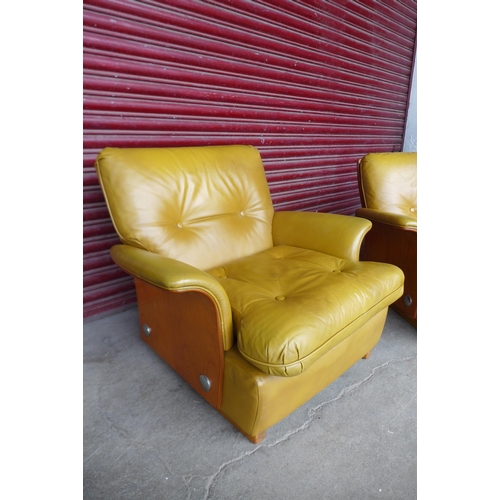 94 - A G-Plan teak and leather upholstered Tulip settee and matching armchair

* Please note this lot may... 