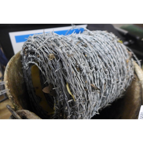 2460 - Reel of barbed wire with galvanised steel bucket