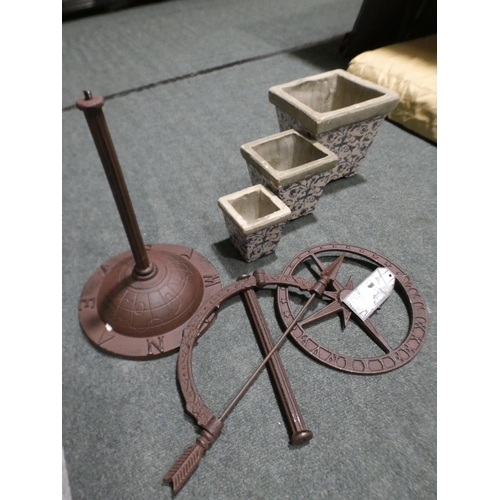 3107 - Decorative metal sundial and three concrete white and blue plant pots * This lot is subject to VAT