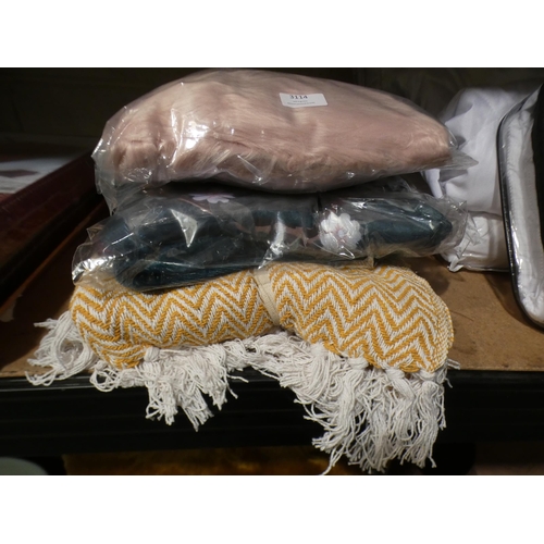 3114 - Two blankets and a pink shaggy sheepskin rug * This lot is subject to VAT