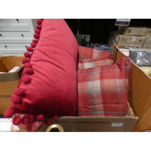 3186 - Six cushions:- set of 4 red tartan and 3 red velvet with pom poms * This lot is subject to VAT