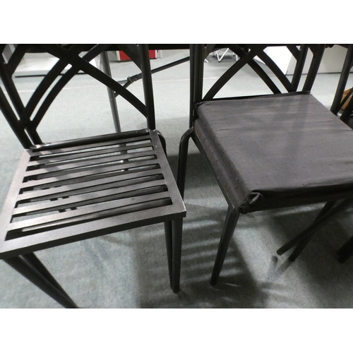 3194h - A set of four black aluminium garden chairs with 2 black cushions