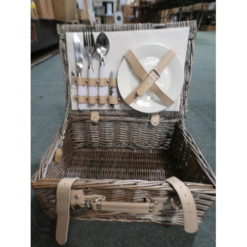 3275 - Set of two wicker picnic baskets, one containing plates and cutlery * This lot is subject to VAT