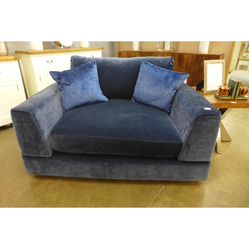 1301 - A blue upholstered Maximus snuggle chair