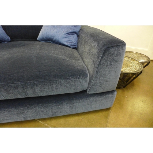 1302 - A blue upholstered Maximus snuggle chair