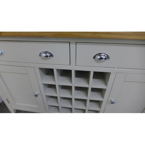 1340 - A Chester grey painted oak two door large sideboard with wine rack (NC-LS-PT) * this lot is subject ... 