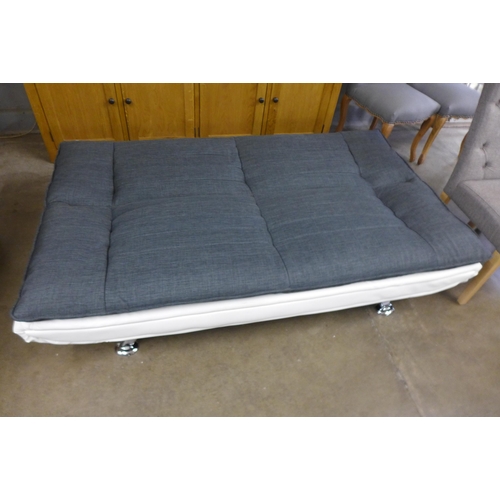 1474 - A cream and charcoal fabric fold down sofa bed