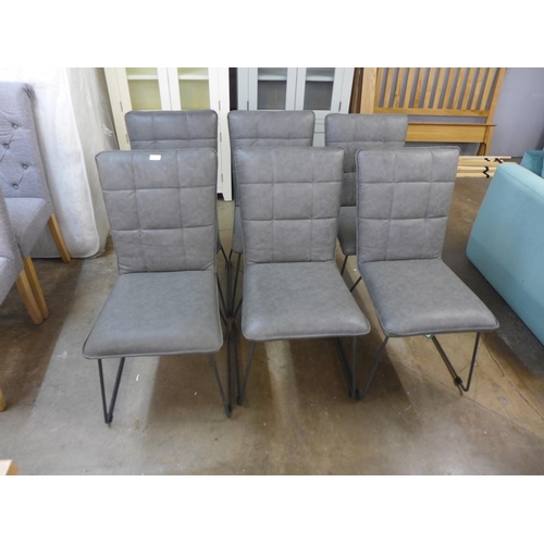 1543 - A set of six grey leather effect dining chairs * this lot is subject to VAT