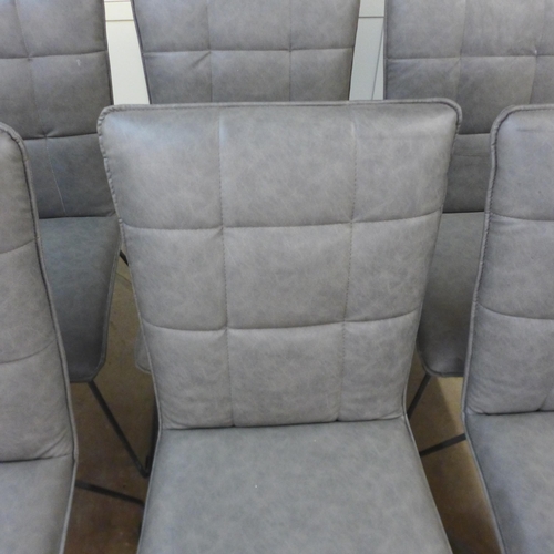 1543 - A set of six grey leather effect dining chairs * this lot is subject to VAT