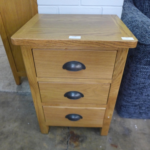 1548 - An oak bedside table  *This lot is subject to VAT