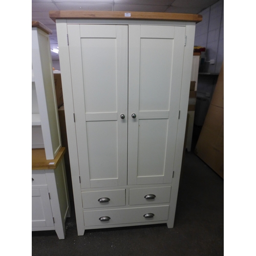 1605 - A Hampshire white painted oak larder unit. Slight damage and various marks * this lot is subject to ... 