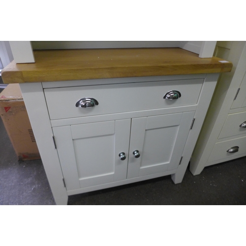 1606 - A Chester white painted oak small dresser, top is loose and warped (NC-SDT-W)  *This lot is subject ... 