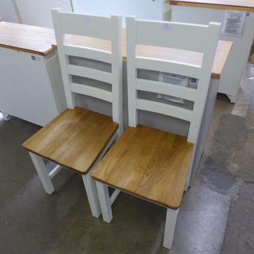 1617 - A pair of white painted oak dining chairs. Slight marks on seat * this lot is subject to VAT