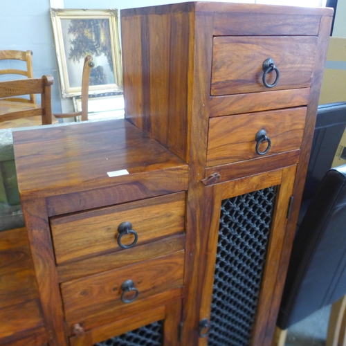 1703 - An oriental hardwood stepped display stand (damage to both ends and front)