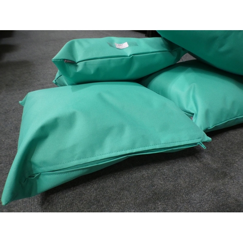 3067 - Four mint green outdoor cushions * This lot is subject to VAT