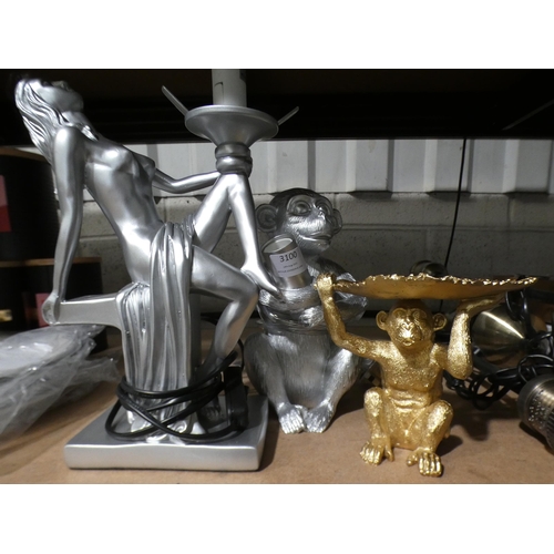 3100 - Two silver painted lamps and a gold painted monkey leaf trinket dish * This lot is subject to VAT