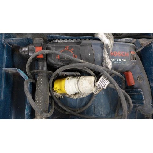 2322 - Bosch 110v drill in case with Port-a-Nail nail gun in case * This lot is subject to VAT