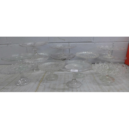 1123 - Thirteen glass cake stands **PLEASE NOTE THIS LOT IS NOT ELIGIBLE FOR POSTING AND PACKING**