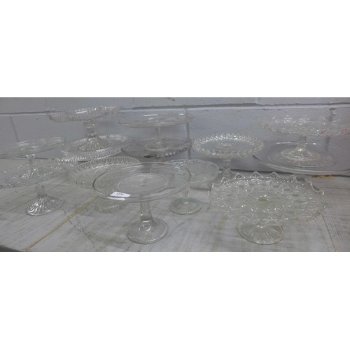 1123 - Thirteen glass cake stands **PLEASE NOTE THIS LOT IS NOT ELIGIBLE FOR POSTING AND PACKING**