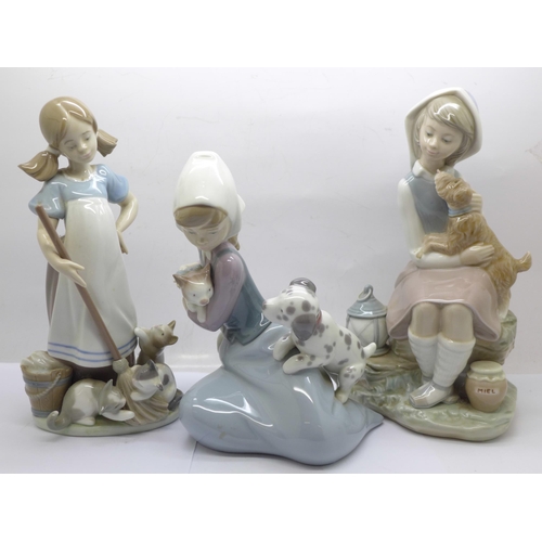 602 - Three Lladro figures, tallest 22cm