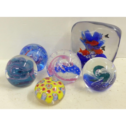 611 - An Italian Murano aquarium paperweight and five other glass paperweights