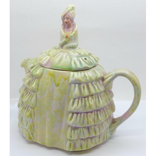 615 - A Ye Daintee Ladyee Crinoline teapot, circa 1930