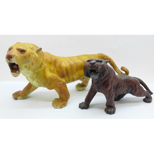 617 - Two cold painted figures of tigers, largest 23.5cm